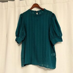 Dark green blouse with strip detail.